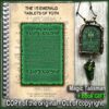 A spiral-bound book titled "THE 15 EMERALD TABLETS OF TOTH" displayed next to a pendant necklace and a "MADE IN ITALY" badge.