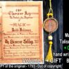 An open document with handwritten-style text titled 'The Clavis or Key to Unlock the Mysteries of Magic', next to a circular golden talisman pendant hanging with a yellow tassel.